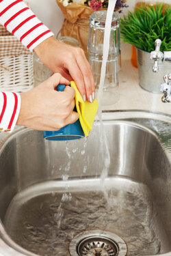 woman-washes-tea-cup.jpg